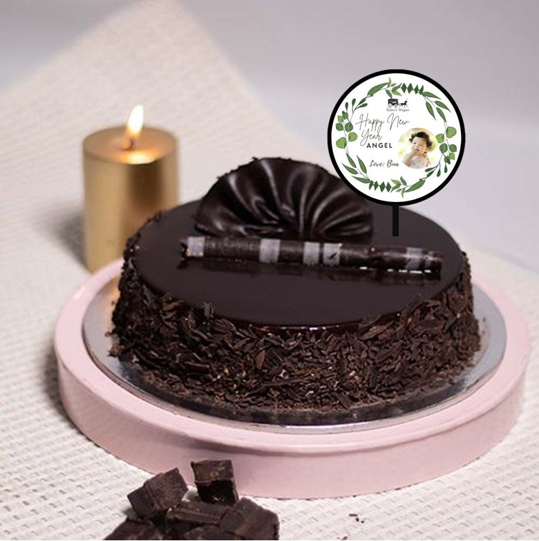 Buy or send New Year Special Eggless Truffle Cake along with custom topper online with Bakers Wagon