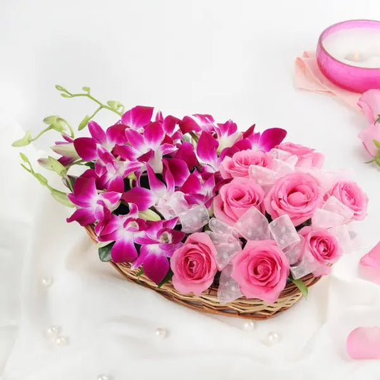Buy or send Mesmerising Arrangement of purple orchids and pink roses online with delivery from Bakers Wagon