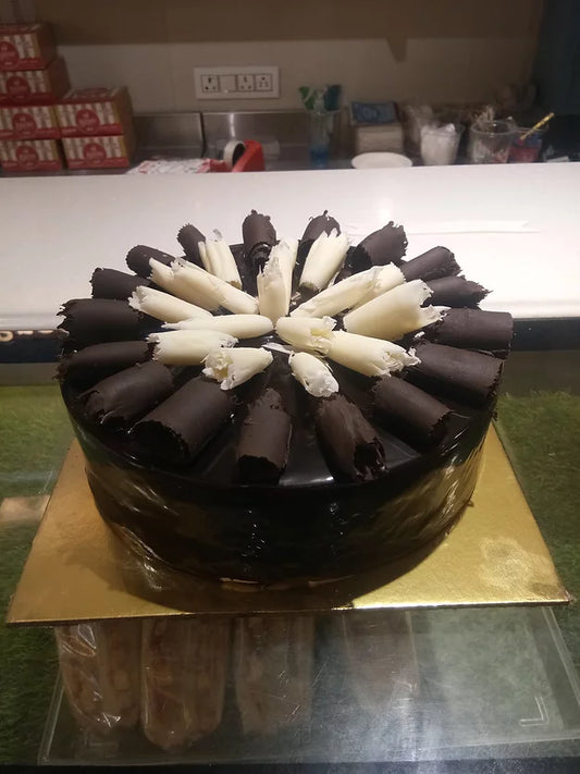 Buy/Send Royal Chocolate Rolls Cake with online delivery by Baker's Wagon