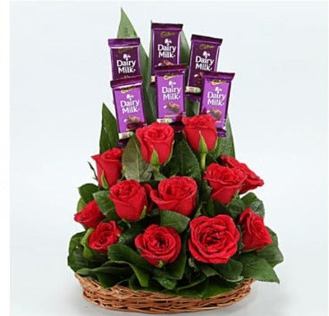 Online Red Roses and Dairy Milk Basket Arrangement delivery with Baker's Wagon