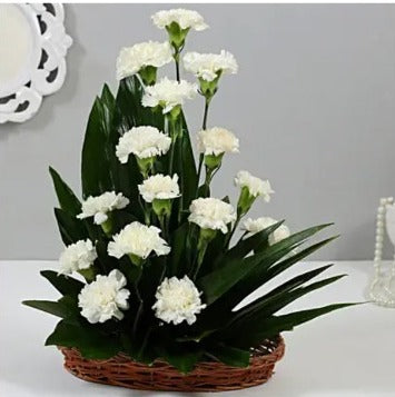 Online White Carnations Cane Basket Arrangement Delivery by Baker's Wagon